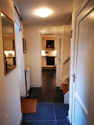 a hallway with a room with a kitchen and a hallway at Unique Courtyard House with Sauna in Alkmaar city center in Alkmaar