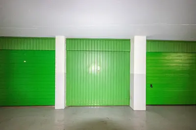 a room with green garage doors in a building at Studio Noordzee in Egmond aan Zee