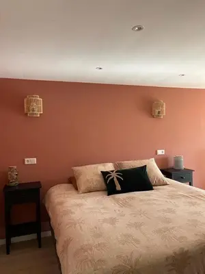 a bedroom with a bed with two pillows on it at Overnachten bij de Haven in Lelystad