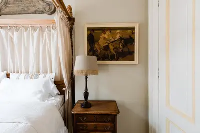 a bedroom with a bed and a lamp on a night stand at Fortuna Spinoza in Monnickendam