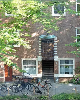 a group of bikes parked in front of a building at Authentic Amsterdam Bed and Breakfast Rai in Amsterdam