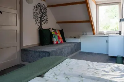 a bedroom with a bed and a window at Munnik's Hof in Amsterdam