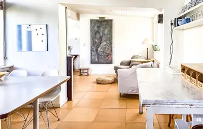 a living room with a table and a couch at 'T Zilt in Bergen aan Zee