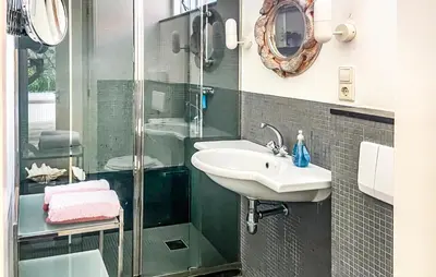 a bathroom with a sink and a shower at 'T Zilt in Bergen aan Zee