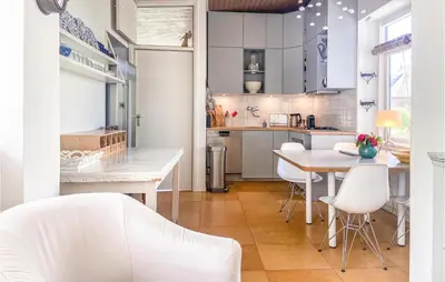a kitchen and dining room with a table and chairs at 'T Zilt in Bergen aan Zee