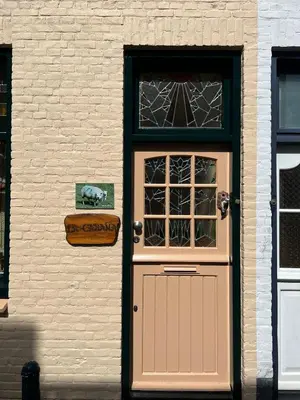 a door to a building with a sign on it at La Cabaña in Zandvoort