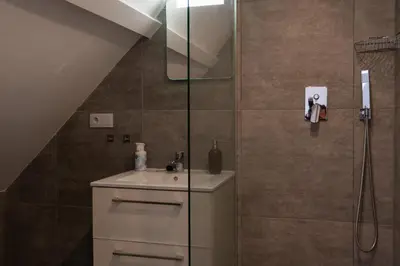 a bathroom with a sink and a shower at Raam Studio's in Amsterdam