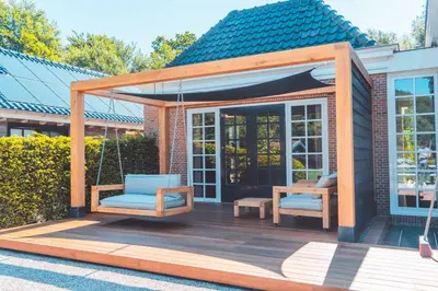 a gazebo with two chairs and a swing at Buitenliefde, romantisch verblijf voor 2 personen in Heiloo
