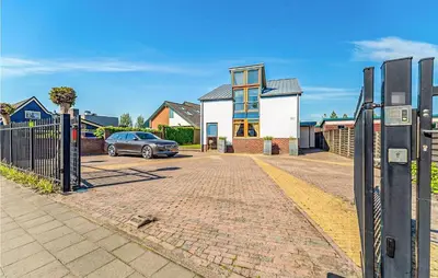 a car parked in front of a house at Nice Home In Breukeleveen With Wifi in Breukeleveen