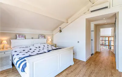 a bedroom with a large white bed in a room at Nice Home In Breukeleveen With Wifi in Breukeleveen