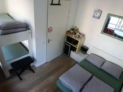 a small room with a bed and a couch at All you need, a comfy place in Amsterdam