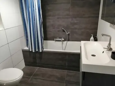 a bathroom with a sink and a toilet at All you need, a comfy place in Amsterdam