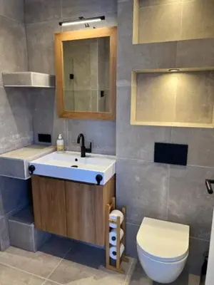 a bathroom with a sink and a toilet at Casa del Cisne 3 in Zandvoort