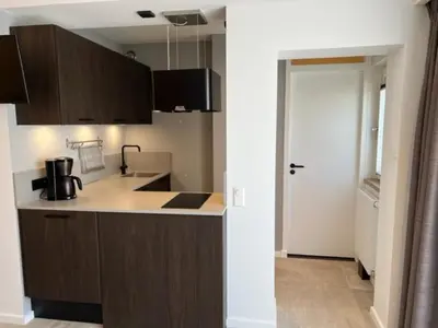 a kitchen with a sink and a counter top at Casa del Cisne 3 in Zandvoort