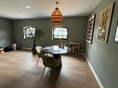 a dining room with a table and chairs at B&B De Meije in Nieuwkoop