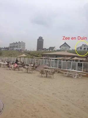 a group of tables and chairs on the beach at Zee en Duin in Zandvoort