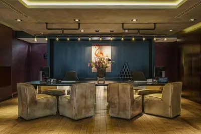 a meeting room with a long table and chairs at DoubleTree by Hilton Amsterdam - NDSM Wharf in Amsterdam