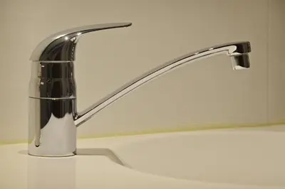 a bathroom sink with a chrome faucet at Luxueuze Studio Herengracht in Amsterdam