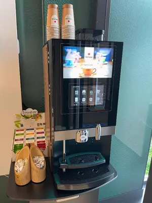 a microwave oven with a tv on top of it at Bens The Walton in Amsterdam