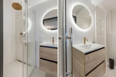 a bathroom with a sink and a shower at Bens The Walton in Amsterdam