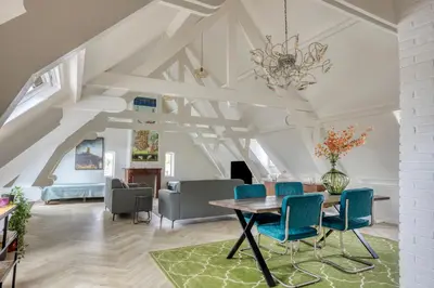 a living room with a table and chairs at Top floor appartment Edam in Edam