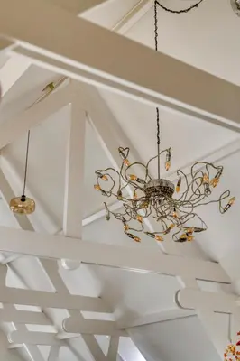 a chandelier hanging from a ceiling in a room at Top floor appartment Edam in Edam