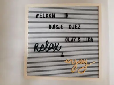 a sign with the words wisdom of music die koko at Stylish holiday home by the sea in Tuitjenhorn