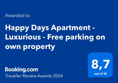 a blue sign that says happy days appointment luxurious free parking at Happy Days Apartment - Luxurious - Free parking on own property in Zandvoort