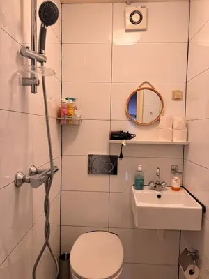 a bathroom with a toilet and a sink at Central B&B Apartment in Amsterdam in Amsterdam