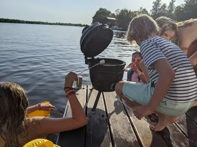 a group of children on a boat in the water at Surla houseboat 