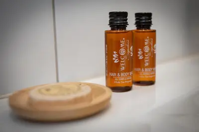 two bottles of essential oils sitting on a counter at Bed & Breakfast Bakker Meijer in Heemskerk