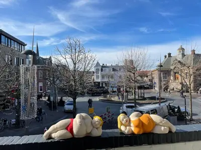 a group of large inflatable animals sitting on a city street at AA Centrum Appartement in Zandvoort