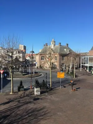 a city street with a building in the background at AA Centrum Appartement in Zandvoort