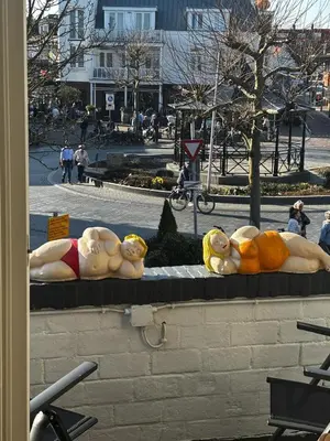 a group of stuffed animals sitting on a wall at AA Centrum Appartement in Zandvoort