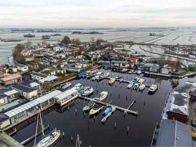 an aerial view of a marina with boats in the water at Oase aan de Kaag in Warmond