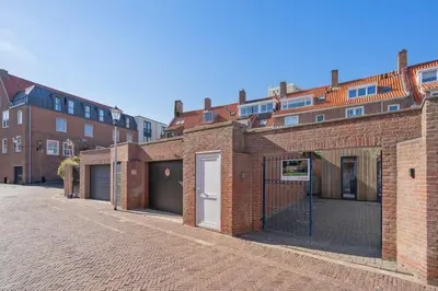 a row of brick buildings on a street at Family Stay Zandvoort - Free parking in Zandvoort