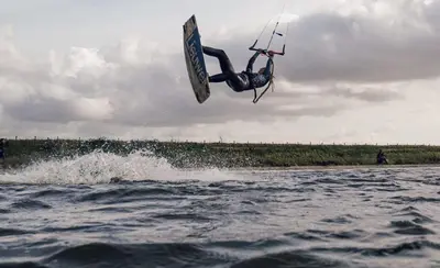 a person doing a trick on a board in the water at Family Stay Zandvoort - Free parking in Zandvoort