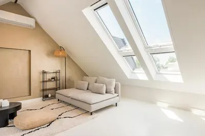 a living room with a chair and a window at Berger Lodge in Alkmaar
