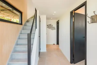 a staircase in a house with a glass door at Berger Lodge in Alkmaar