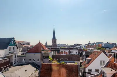 an aerial view of a city with a church steeple at Bluys Apartment in Zandvoort