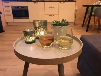 a table with four glasses of whiskey on it at Blossombed in Voorhout