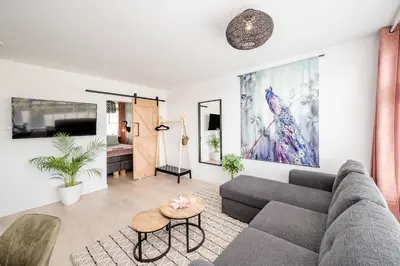 a living room with a couch and a table at Amsterdam Beach Apartment 52 in Zandvoort