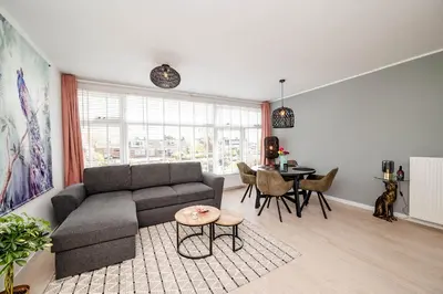a living room with a couch and a table at Amsterdam Beach Apartment 52 in Zandvoort