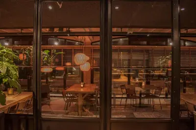 a dining room with a table and chairs at Strandhotel Golfzang in Egmond aan Zee