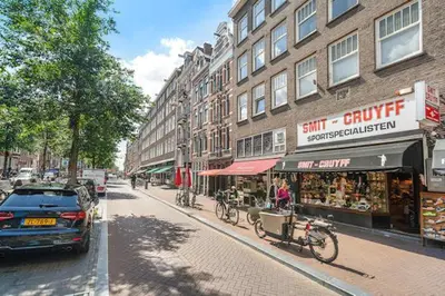 a car parked on a street next to a building at Resident Moose in Amsterdam