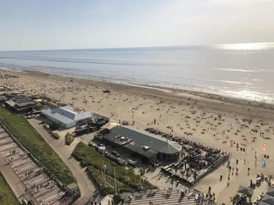 an aerial view of a beach with a crowd of people at Top View in Zandvoort