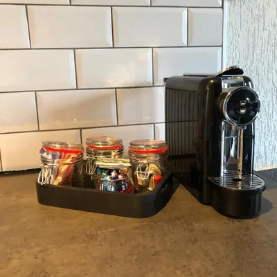 a coffeemaker and a coffee maker next to a counter at Kingstreet Apartment in Zandvoort