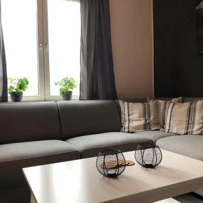 a living room with a couch and a coffee table at Kingstreet Apartment in Zandvoort