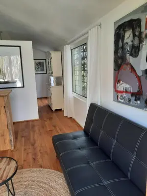 a living room with a couch and a table at Arthouse Lola in Bergen