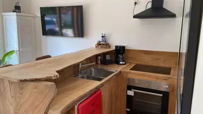 a kitchen with a wooden counter top and a sink at Arthouse Lola in Bergen